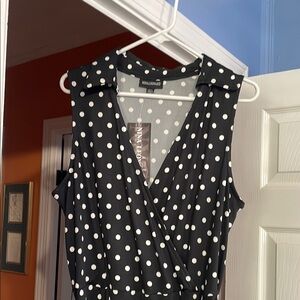 Nina Leonard Black and White Sleeveless Polka Dot collared jumpsuit.